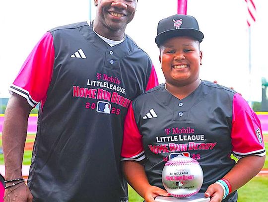 DeMarcos “DJ” Mieses receives his trophy from former Philadelphia Phillies star Ryan Howard.