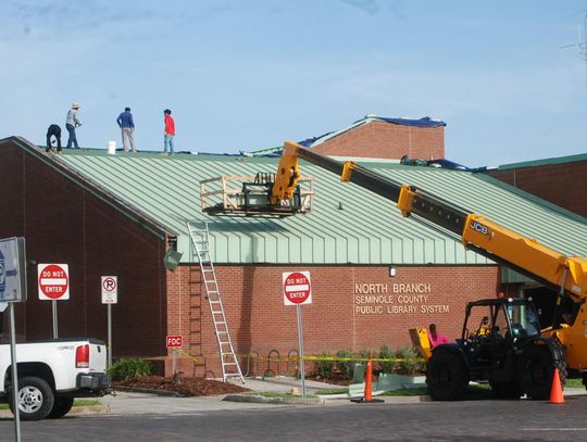 Finishing touches on library roof