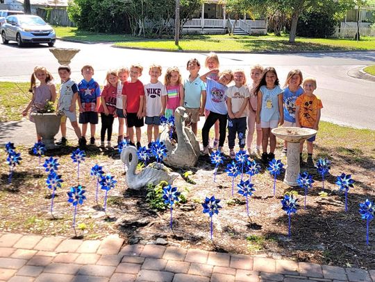 Wee The People Preschool honors Child Abuse Awareness Month with a Pinwheel Garden