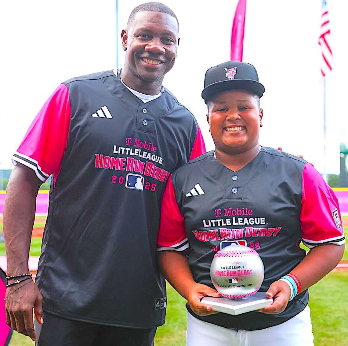 DeMarcos “DJ” Mieses receives his trophy from former Philadelphia Phillies star Ryan Howard.