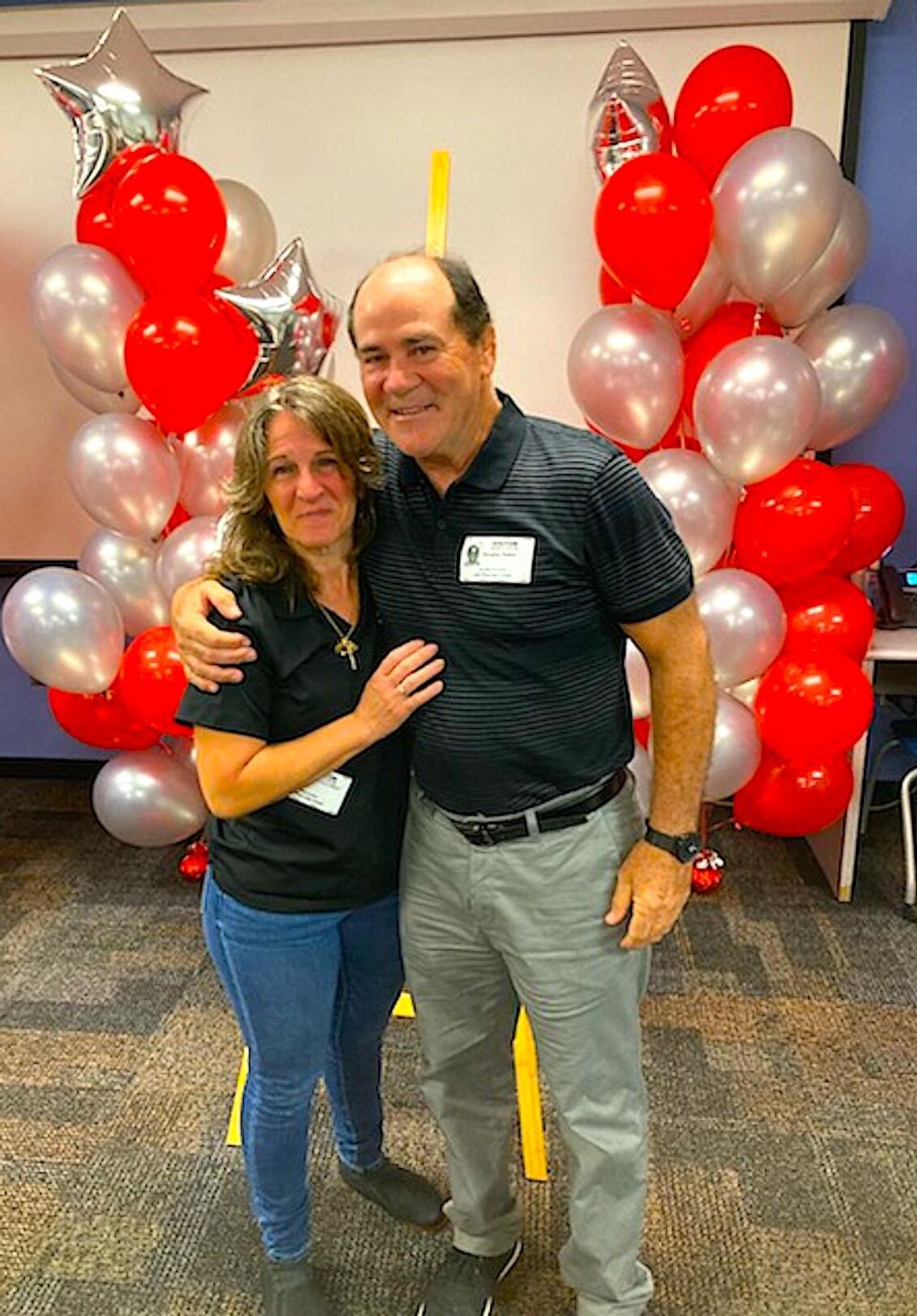 Photo submitted _ The football facility at Lake Mary High School’s Don T. Reynolds has been renovated and the playing surface will be named in honor of longtime coach and Athletic Director Doug Peters (on right, above, right).