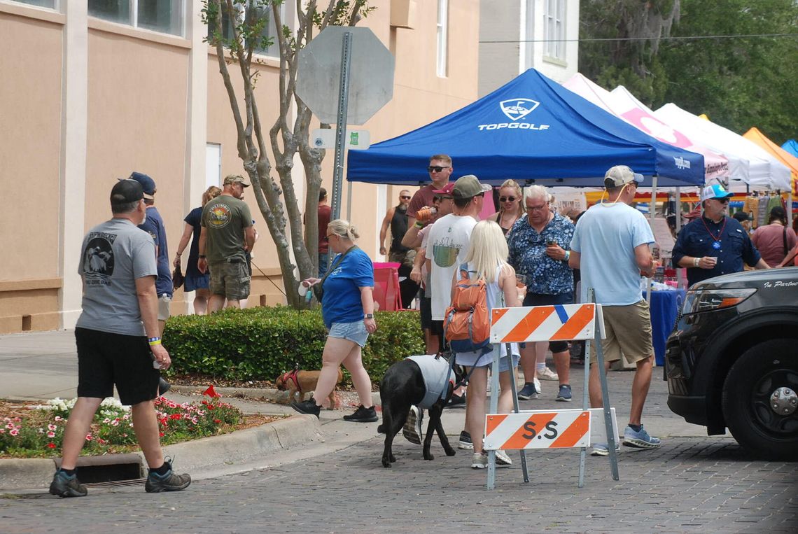 Crowd Gathers at Pints and Paws Event in Sanford