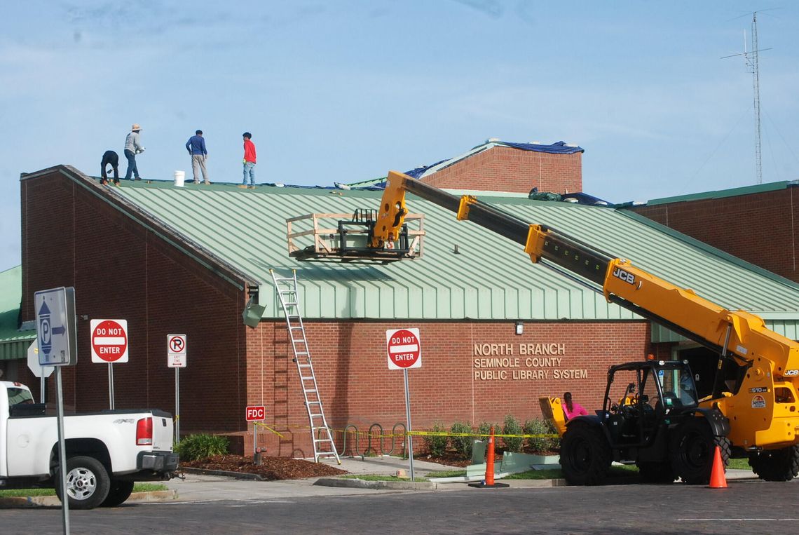 Finishing touches on library roof Finishing touches on library roof